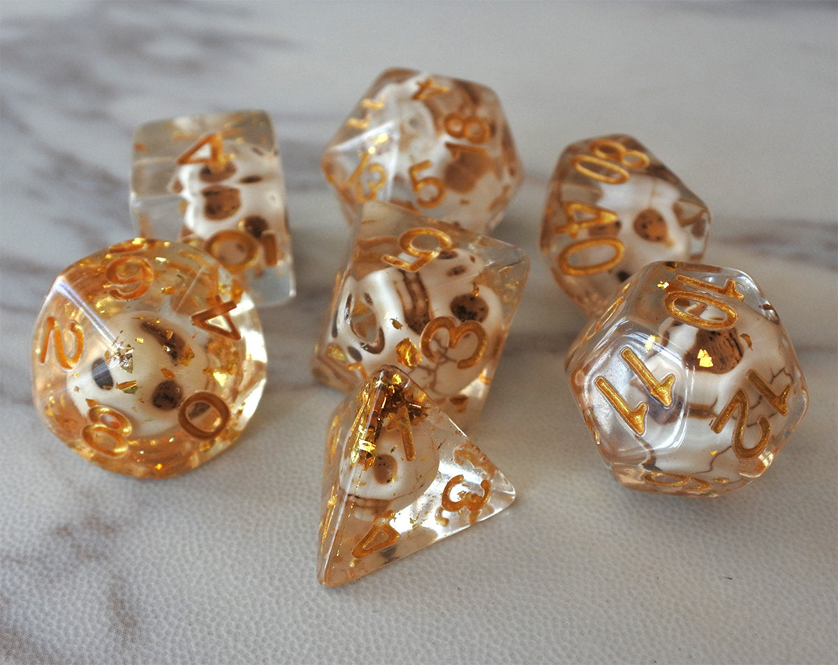 Skulls Laying in Golden Treasure Dice Set (Give away a random dice set)