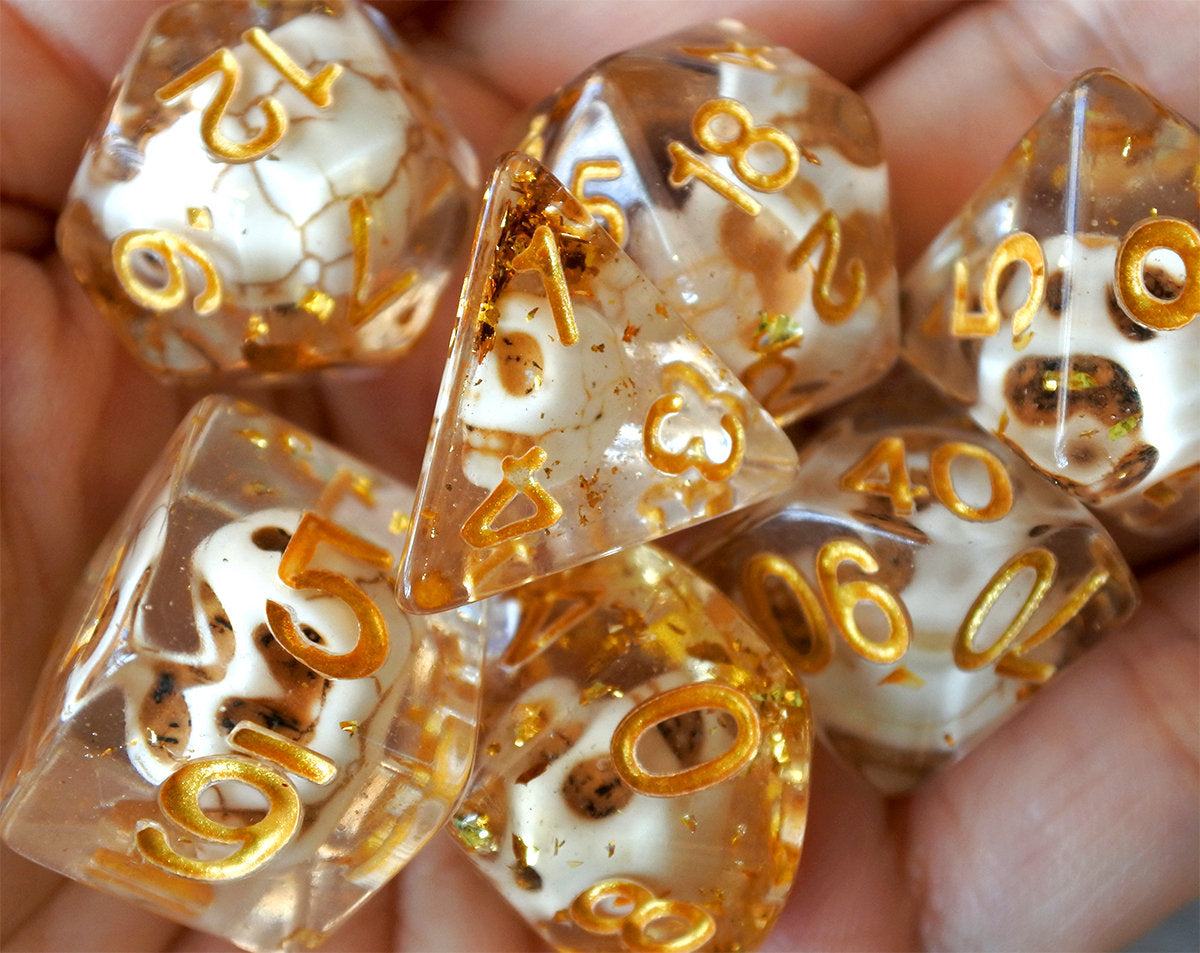 Skulls Laying in Golden Treasure Dice Set (Give away a random dice set)