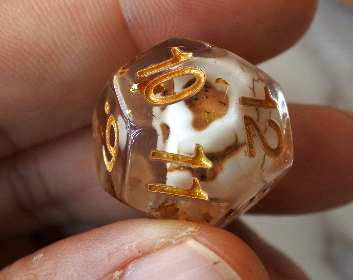 Skulls Laying in Golden Treasure Dice Set (Give away a random dice set)